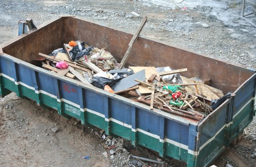 Professional house clearance team preparing to dispose of a refrigerator