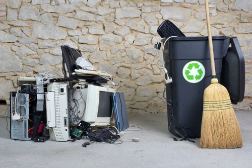 Fridge being collected by a local waste management service