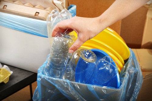 Professional technician handling fridge disposal