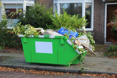 Professional technicians disposing of refrigerators